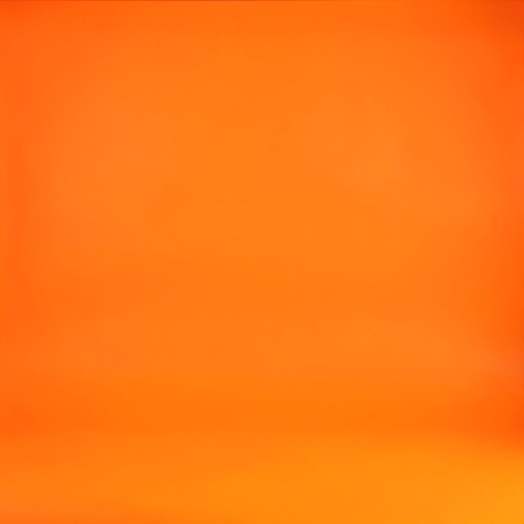 A studio photograph of a figure reflected in a bathroom mirror, layered with warm amber and muted teal tones suggesting introspection across time